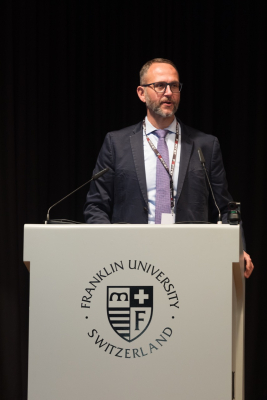 State Councilor Norman Gobbi giving a speech on the stage