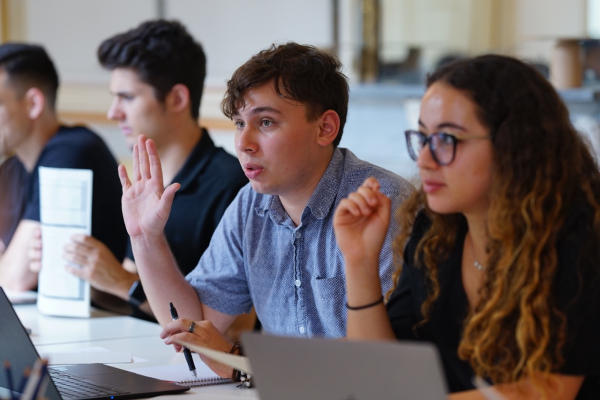 A student asking a question during the lesson