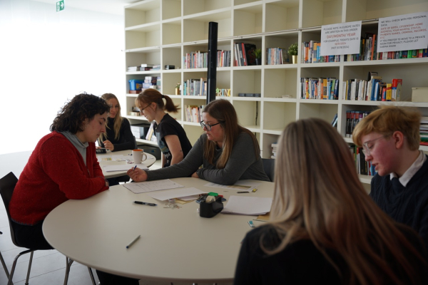 Students filling forms for Swiss law and regulation